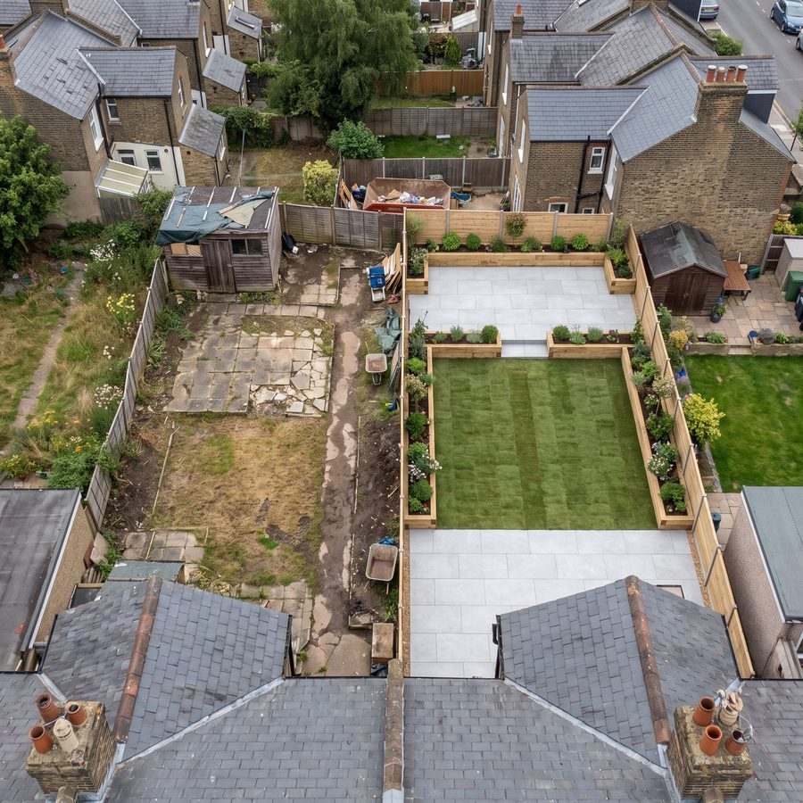 Aerial view of a garden mid transformation, old surfacing on one side and new on the other